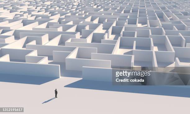 businessman looking at maze entrance - problem stock pictures, royalty-free photos & images