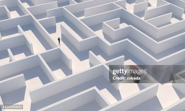 businessman inside maze - maze stock pictures, royalty-free photos & images