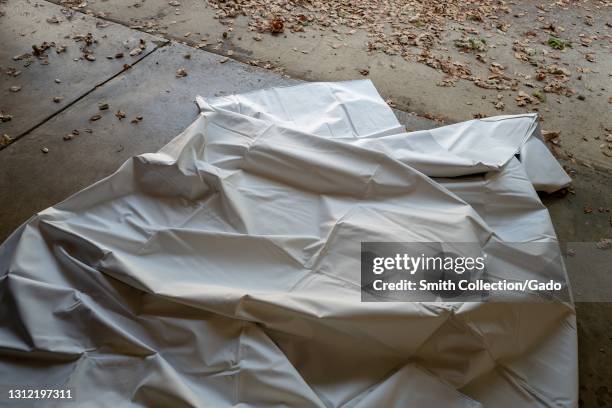 Crumpled painter's dropcloth on garage floor, Lafayette, California, November 17, 2020.