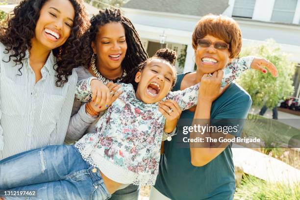 portrait of three generation family during outdoor celebration - black family reunion stock pictures, royalty-free photos & images