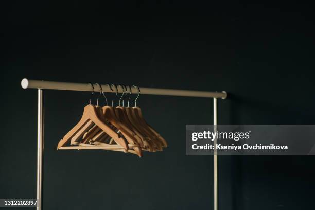 clothes hangers on the rod - coat check stock pictures, royalty-free photos & images