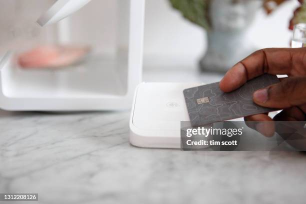 customer using contactless payment at modern wine bar counter, close-up - contactless payment 個照片及圖片檔