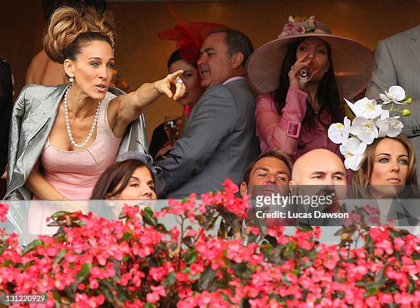Shane Warne, Elizabeth Hurley and Sarah Jessica Parker attend the Crown box during Crown Oaks Day at Flemington Racecourse on November 3, 2011 in...