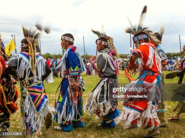 lineup of dancers - taos pow-wow - powwow stock pictures, royalty-free photos & images