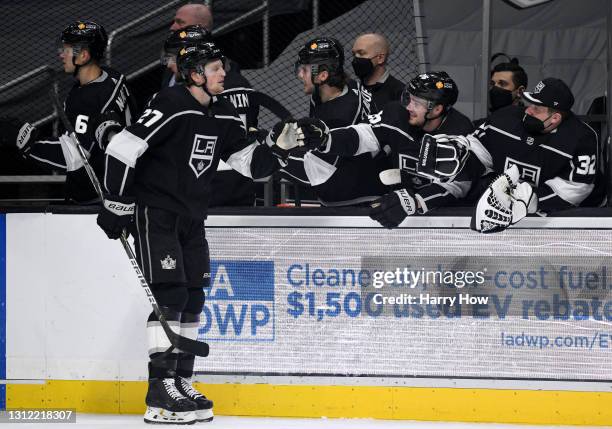 Austin Wagner of the Los Angeles Kings celebrates his goal with Sean Walker and Jonathan Quick, to take a 1-0 lead over the Vegas Golden Knights,...