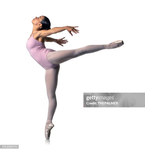 ballerina stands in ballet arabesque - ballet arabesque stock pictures, royalty-free photos & images