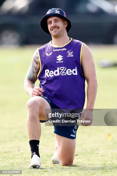 Cameron Munster of the Storm stretches during a Melbourne Storm NRL training session at Gosch's Paddock on April 13, 2021 in Melbourne, Australia.