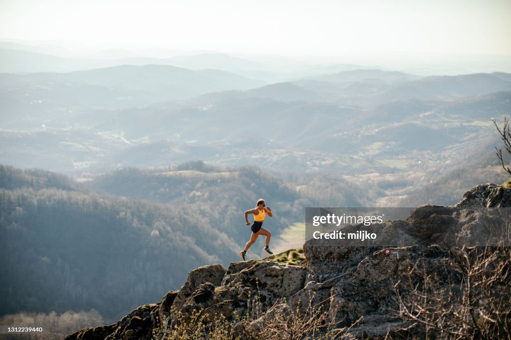 Woman running on mountain