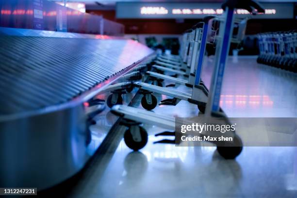 baggage claim area - baggage claim stock pictures, royalty-free photos & images