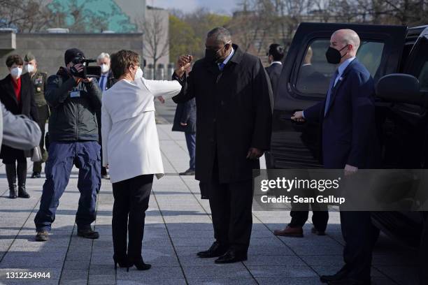 German Defense Minister Annegret Kramp-Karrenbauer greets new U.S. Defense Secretary Lloyd Austin with a socially-distanced elbow touch at the...