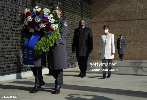 German Defense Minister Annegret Kramp-Karrenbauer and new U.S. Defense Secretary Lloyd Austin follow an honour guard to lay a wreath at a memorial...