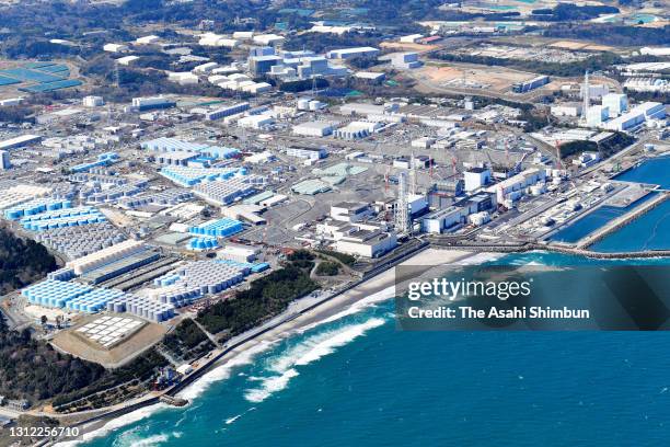 In this aerial image, tanks holding radiation-contaminated water are seen in the premises of Tokyo Electric Power Co's crippled Fukushima Daiichi...