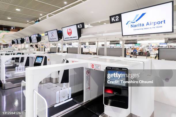 Corporation's "Face Express" system is demonstrated at the check-in counter of Narita International Airport on April 13, 2021 in Narita, Japan. NEC...