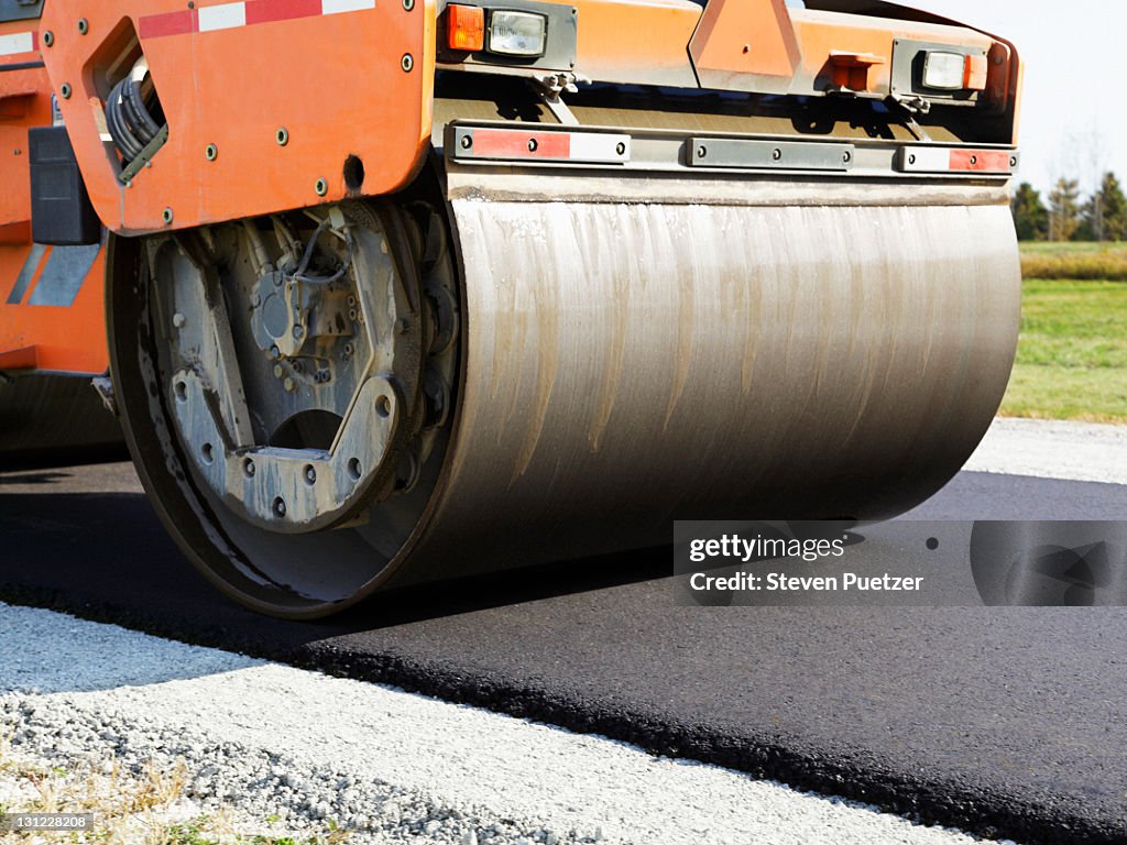 Steamroller rolling asphalt