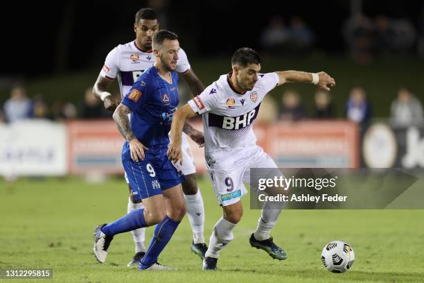 Bruno Fornaroli of Perth Glory is conested by Roy O'Donovan of the Jets during the A-League match between the Newcastle Jets and the Perth Glory at ,...