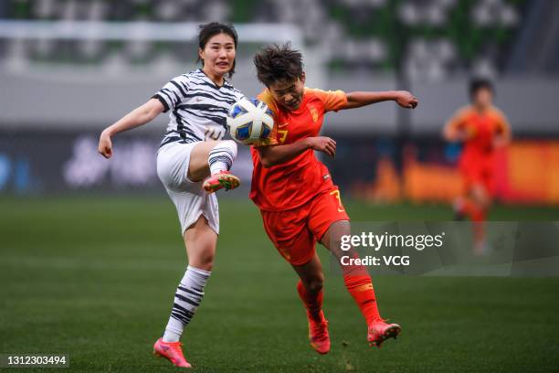 Wang Shuang of China and Kang Chae-rim of South Korea fight for the ball during the Tokyo Olympics Women's Football Asian Final Qualifier 2nd leg...