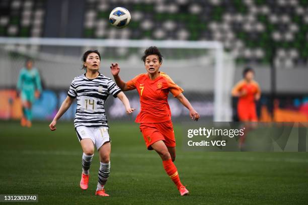 Wang Shuang of China and Kang Chae-rim of South Korea fight for the ball during the Tokyo Olympics Women's Football Asian Final Qualifier 2nd leg...