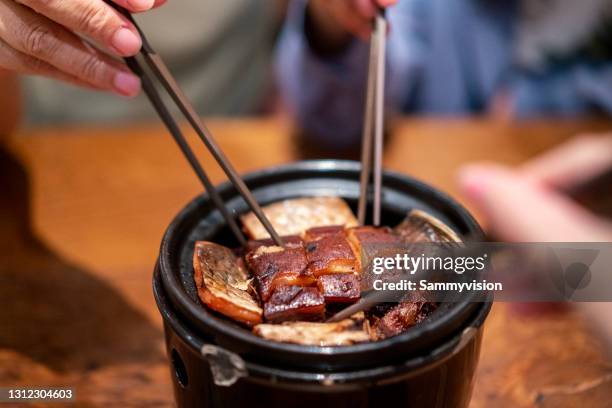 close-up of dongpo pork on wooden table - caramel block stock pictures, royalty-free photos & images