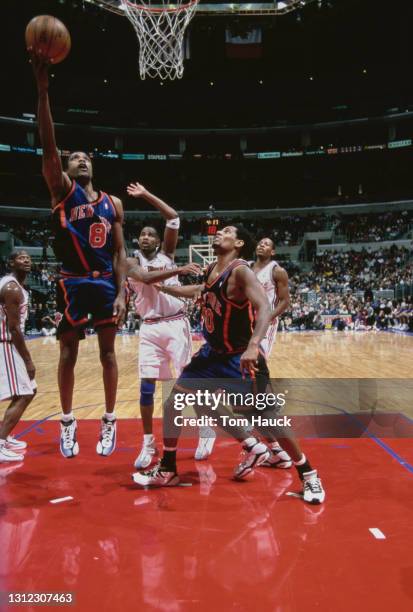 Kurt Thomas, Power Forward and Center for the New York Knicks makes a one handed layup shot to the hoop during the NBA Pacific Division basketball...