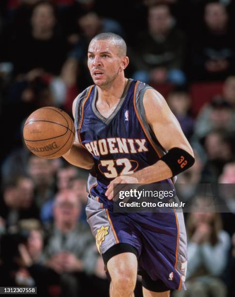 Jason Kidd, Point Guard and Shooting Guard for the Phoenix Suns dribbles the basketball down court during the NBA Pacific Division basketball game...