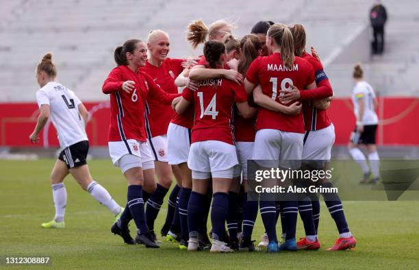 Guro Reiten of Norway celebrate with her team mates after scoring the opening goal during the Women's International Friendly match between Germany...