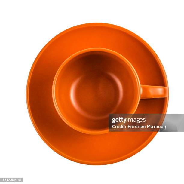 tea coffee cup and saucer red orange empty isolated on white background. top view. flat lay. - untertasse stock-fotos und bilder