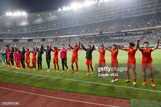 Players of China celebrate victory after the Tokyo Olympics Women's Football Asian Final Qualifier 2nd leg match between China and South Korea at the...