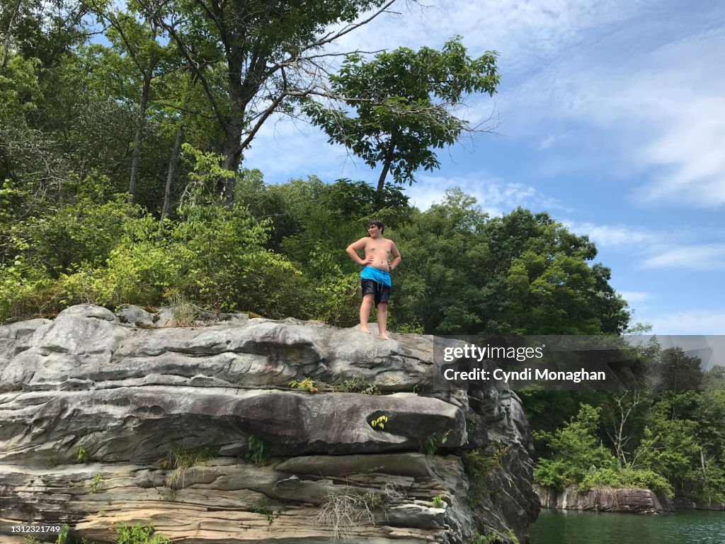 Boy Getting Ready to Jump off Rocks at Summersville Lake