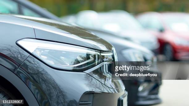 presentation of used vw vehicles at a public car dealer in hamburg, germany - used car selling stock pictures, royalty-free photos & images