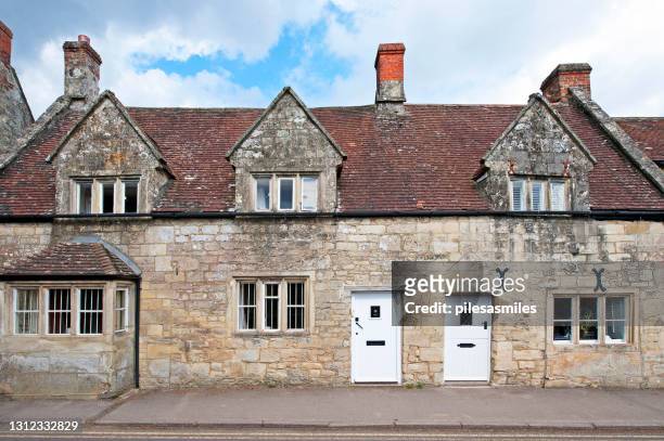 old stone built cottages in tisbury, wiltshire, england - wiltshire stock pictures, royalty-free photos & images