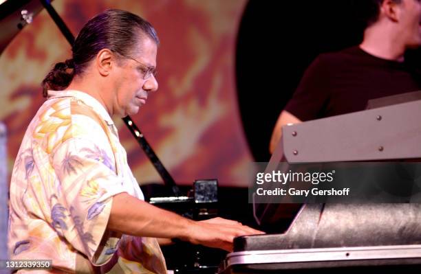 View of Jazz musician, composer, and bandleader Chick Corea plays electric piano as he performs onstage, with his Elektric Band, during a free...