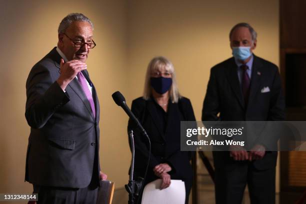 Senate Majority Leader Sen. Chuck Schumer speaks as Sen. Patty Murray and Sen. Tom Carper listen during a news briefing after a weekly Senate...