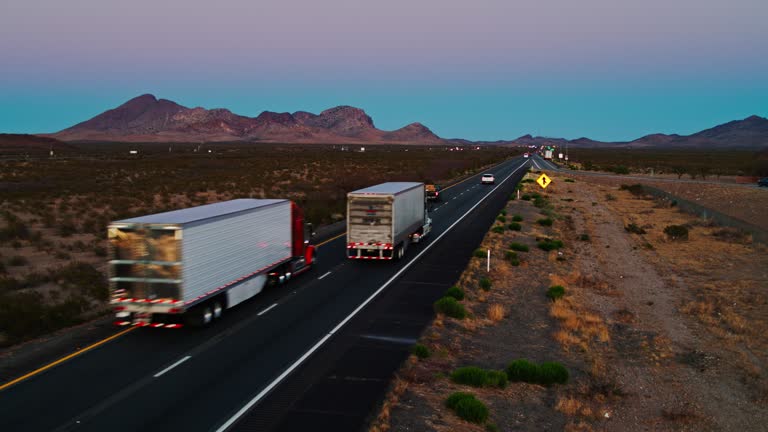 https://media.gettyimages.com/id/1312348173/video/trucks-on-i-10-at-dusk-aerial.jpg?b=1&s=640x640&k=20&c=Y4ualtQE87cbaQ08rpTtOMuIuR5yXMnIoh_tZD4r_ss=