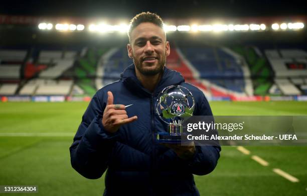 Neymar of Paris Saint-Germain poses for a photo with the Player of the Match trophy after the UEFA Champions League Quarter Final Second Leg match...