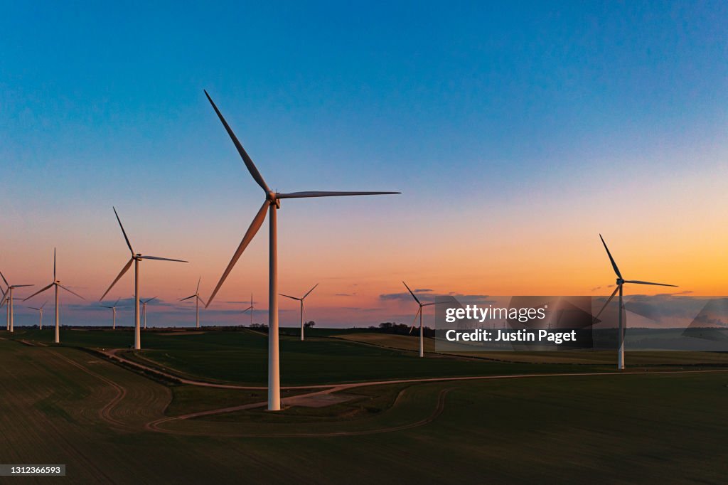 Drone view of a wind farm. Multiple wind turbines