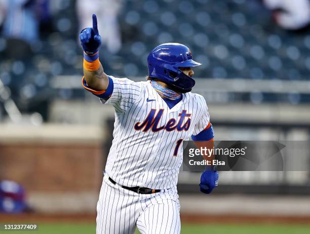 Jonathan Villar of the New York Mets celebrates his hit that drove in the game winning run against the Philadelphia Phillies during game one of a...