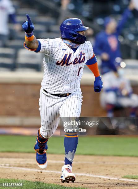 Jonathan Villar of the New York Mets celebrates his hit that drove in the game winning run against the Philadelphia Phillies during game one of a...