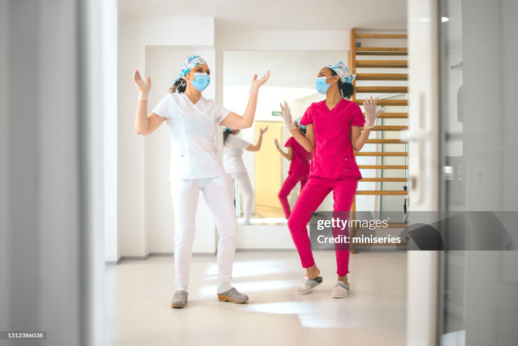 Female Nurses Dancing and Having Fun at Work
