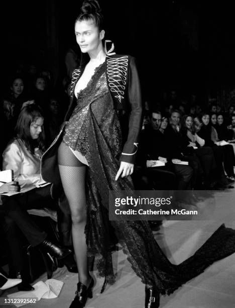 Model Helena Christensen walks the runway at British fashion designer Alexander McQueen's first New York fashion show at a former synagogue on...