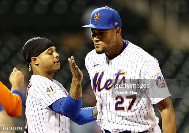 Marcus Stroman of the New York Mets congratulates Jeurys Familia on the save after the game against the Philadelphia Phillies during game two of a...