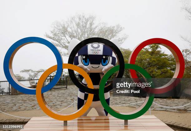 Tokyo 2020 Olympic Games mascot Miraitowa poses with the Olympic Symbol after unveiling ceremony on Mt. Takao to mark 100 days before the start of...