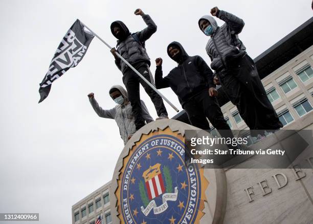 Protesters posed for photos at an FBI Building in Brooklyn Center during a rally in response to the death of Daunte Wright, Tuesday, April 13, 2021...