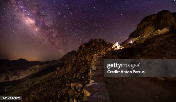 mount sinai at night under the starry sky with the milky way. sinai mountains, egypt - mont sinaï photos et images de collection