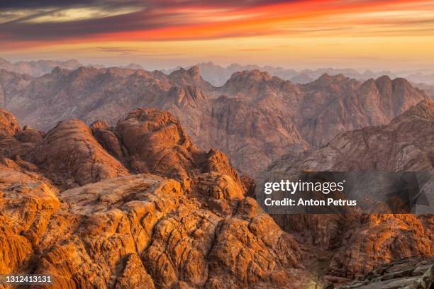 view from mount sinai at sunrise. beautiful mountain landscape in egypt - sinai egypt stockfoto's en -beelden