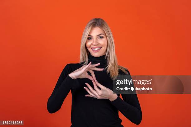 deaf woman using sign language - sign stock pictures, royalty-free photos & images