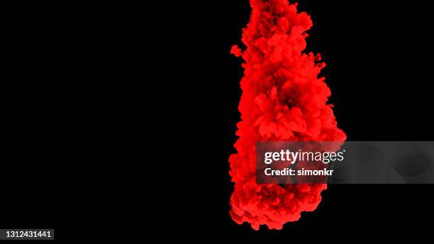 red colour ink drop falling into water - color explosion water stock pictures, royalty-free photos & images