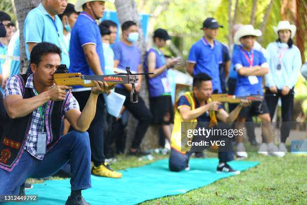 Contestants attend a crossbow shooting competition to welcome the Sanyuesan Festival on April 13, 2021 in Sanya, Hainan Province of China. The...