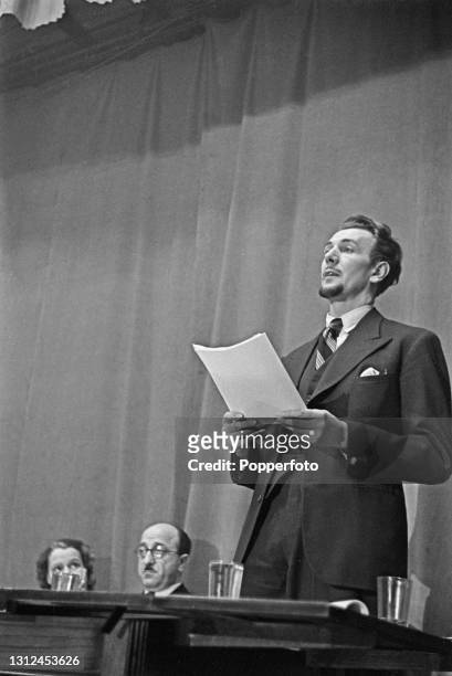 English actor Michael Redgrave speaks in a debate 'Should the Cinema and Theatre be used for propaganda' held at Melchett Hall in London, England...