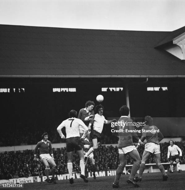 Mike England and Alan Gilzean of Tottenham Hotspur and Trevor Whymark and Colin Viljoen of Ipswich Town during a League Division One match at White...