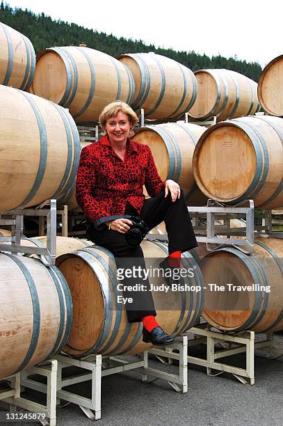 woman sitting on barrel - wine barrel stock pictures, royalty-free photos & images